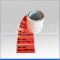 Warning label "Vorsicht Spurenträger", luminous red 