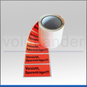 Warning label "Vorsicht Spurenträger", luminous red 